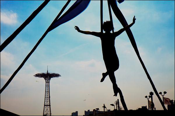 House of Yes silk aerialists perform on the Coney Island boardwalk following the 2010 Mermaid Parade.