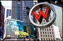W Hotel logo sign with Watchmen movie poster. Times Square. 2009.