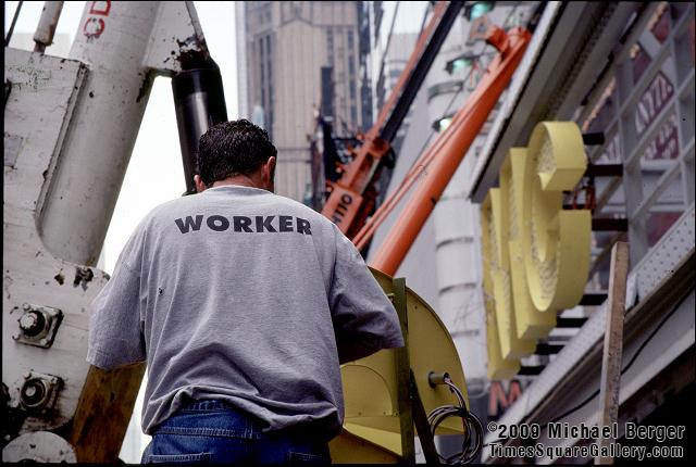 Sign installer, south side of 42nd St. between 7th Ave.and 8th Ave.. 2002.