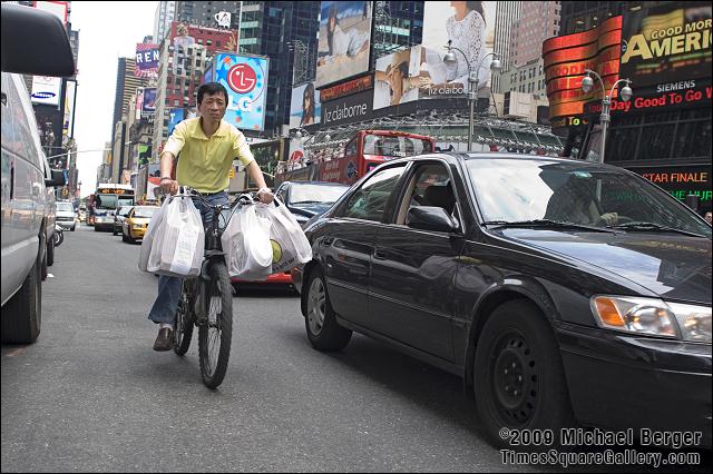 Delivery man, 7th Ave between 43rd St. and 44th St.. 2006.