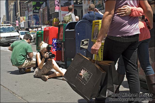 Photographer, models, assistant, NW corner of 7th Ave. and 46th St.. 2006.