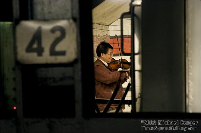 Musician, subway platform below 42nd St. and 6th Ave.. 2006.